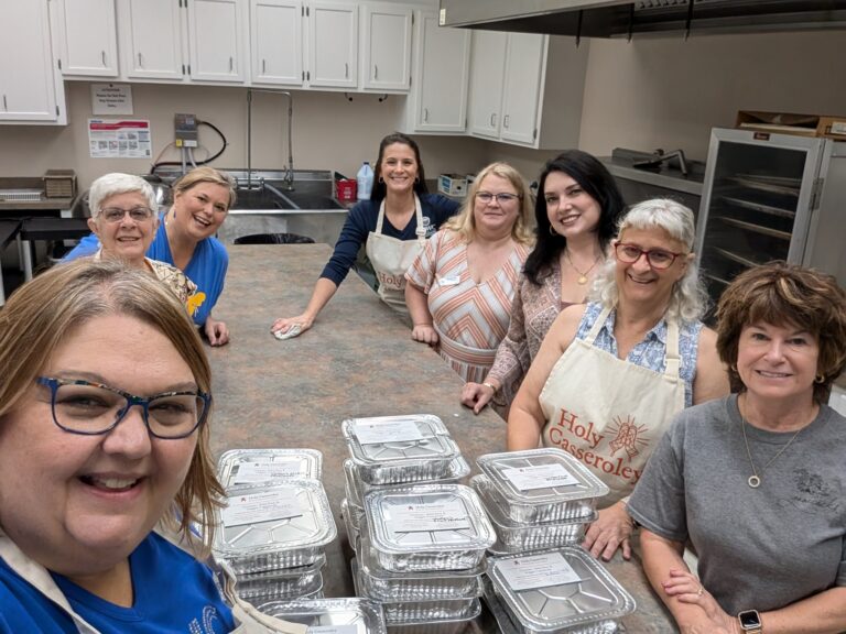 Susan, Linda B., Linda W. Lindsay, Renee', Stephanie, Carol along with 24 casseroles we prepared for Holy Casseroley (pictured with one of their directors) for our GFWC National Day of Service 2024 Project.