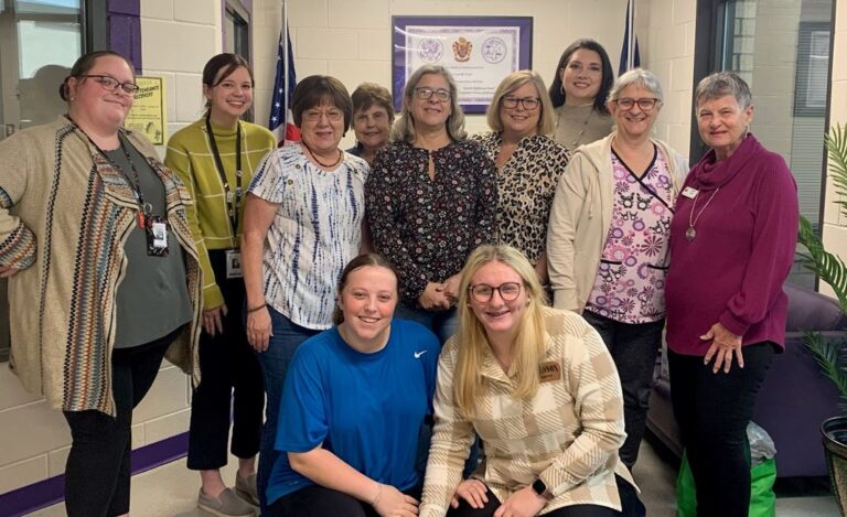 Lesa, Kathy, Mary Jean, Linda W., Stephanie, and Carol with Swansea HS Staff & Students when delivering donations of items for the Beta Club's Hygiene Closet Project.